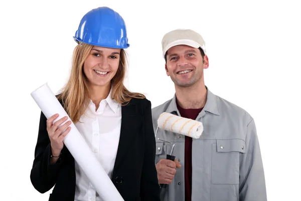 stock image Male house painter and female construction manager