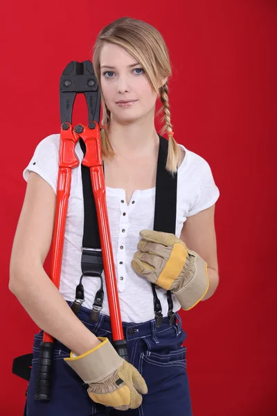 Woman holding bolt-cutters — Stock Photo, Image