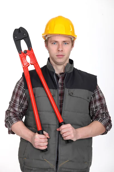Tradesman holding large clippers — Stock Photo, Image