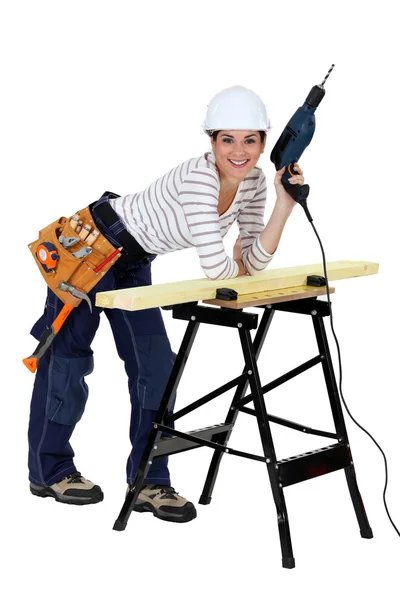 Craftswoman holding a drill — Stock Photo, Image