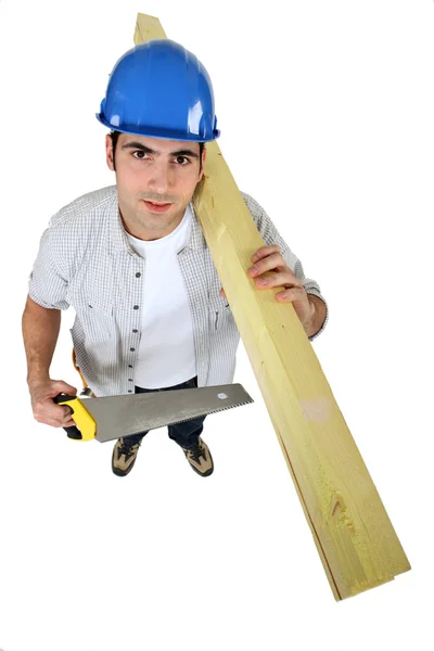 Tradesman holding planks of wood — Stock Photo, Image