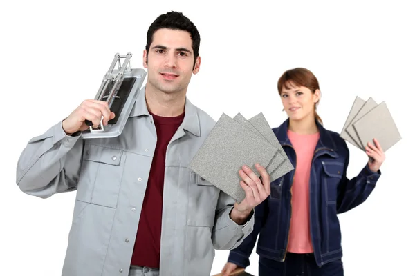 Couple with a tile cutter — Stock Photo, Image