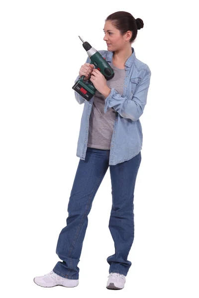 Woman with a power drill Royalty Free Stock Images