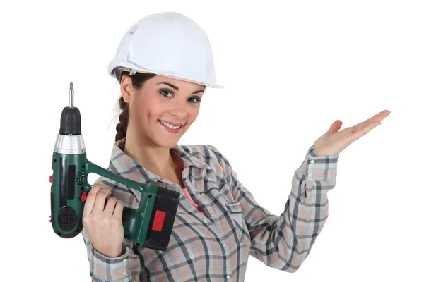 Craftswoman holding a drill Stock Image