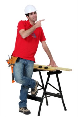 Carpenter giving directions. clipart