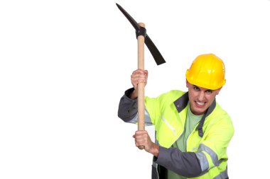 Angry construction worker holding a pickaxe clipart