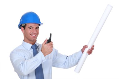 Architect with plans and blue-prints clipart