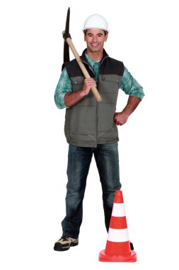 Construction worker with a pickaxe clipart