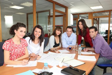 Staff meeting in an office clipart