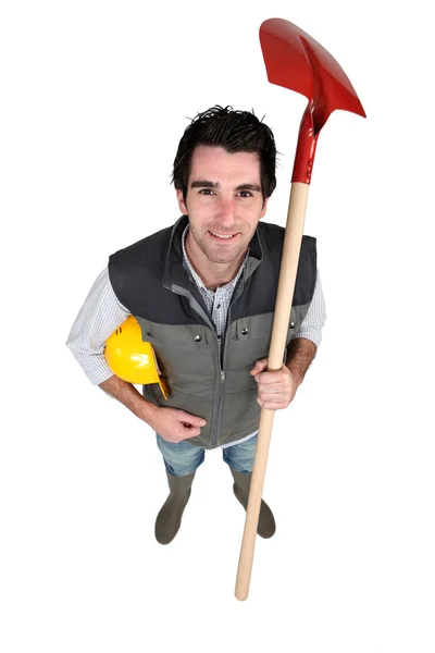 Craftsman holding a shovel — Stock Photo, Image