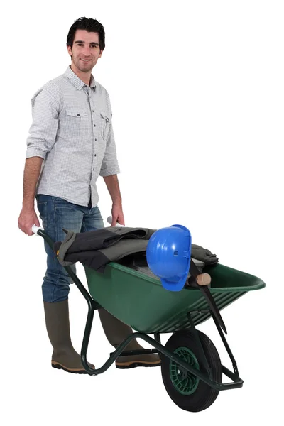 A construction worker with a wheelbarrow. — Stock Photo, Image