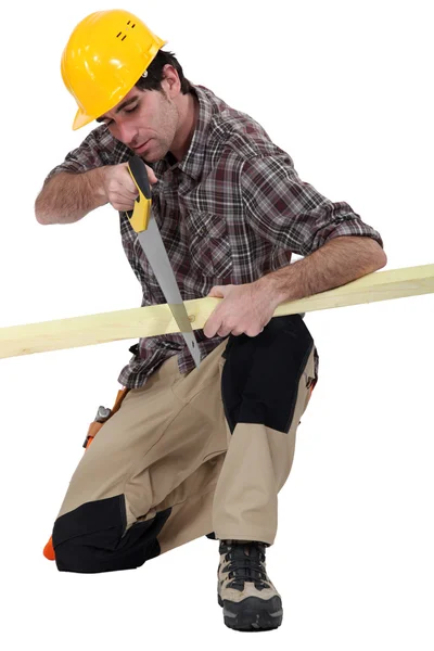 Carpenter with a handsaw — Stock Photo, Image