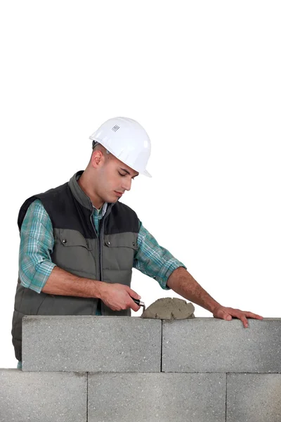 stock image Man spreading mortar with a trowel