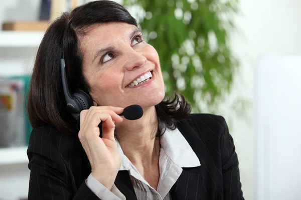 Businesswoman with a headset — Stock Photo, Image