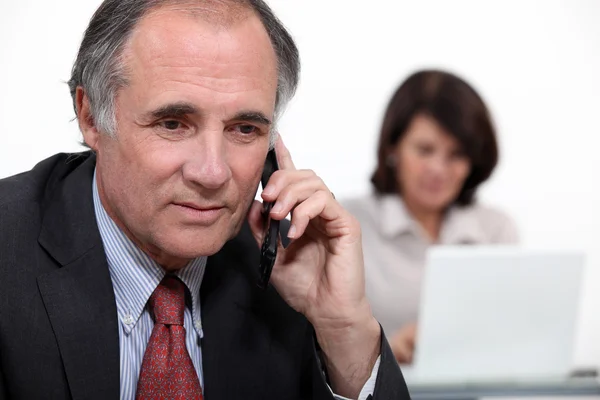 Pareja de negocios de mediana edad — Foto de Stock