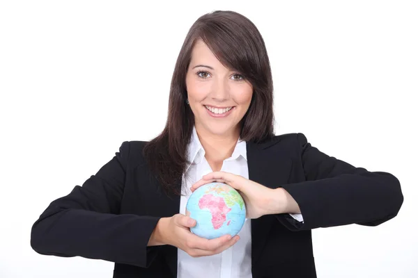 Woman holding world globe in her hands — Stock Photo, Image