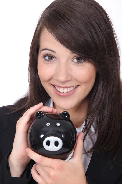 Brunette vrouw met piggy bank — Stockfoto