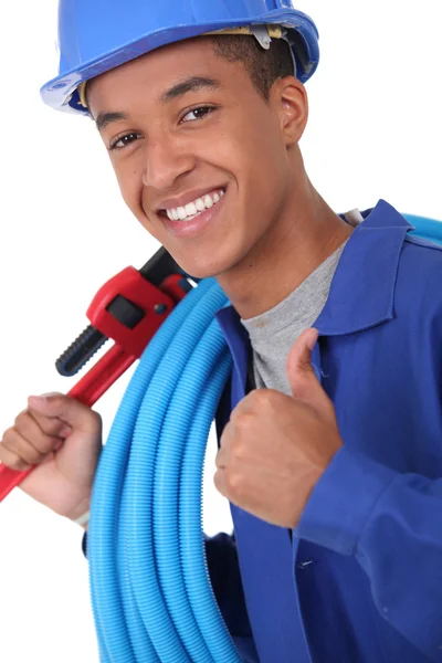 Young plumber with a wrench — Stock Photo, Image