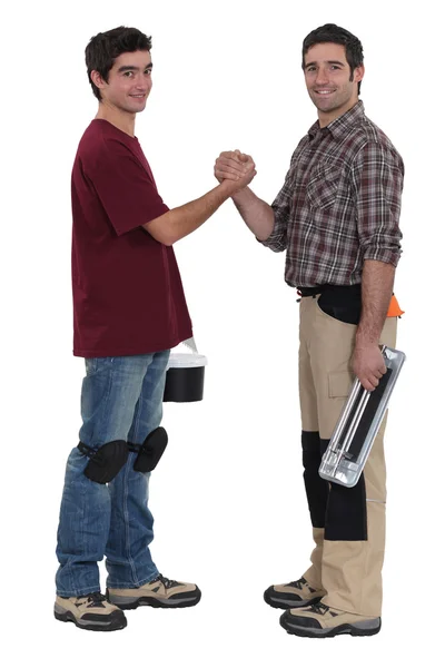 Two manual workers greeting each other — Stock Photo, Image