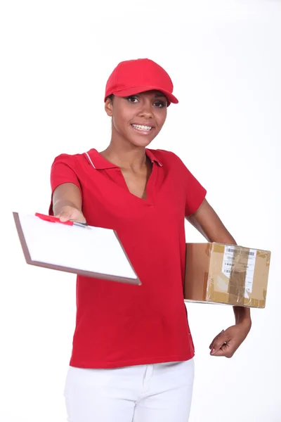 Delivery girl with a package — Stock Photo, Image