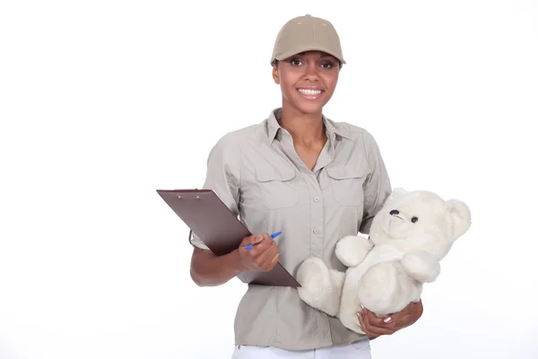 Delivery of packages with teddy bear — Stock Photo, Image