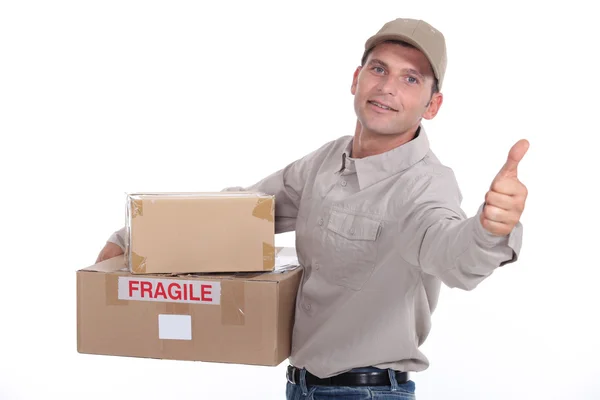 Delivery man giving the thumb's up — Stock Photo, Image