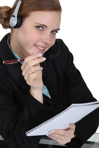 A businesswoman answering a hotline. Stock Photo