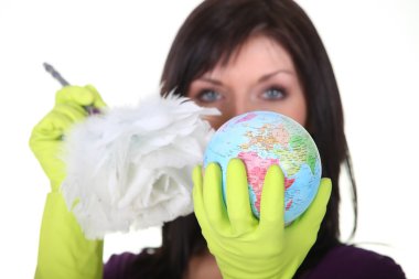 A charwoman cleaning a globe clipart