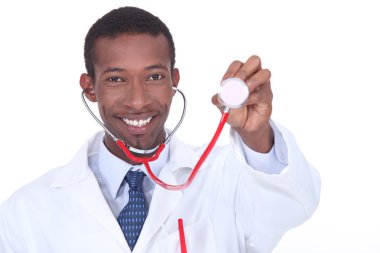 Physician holding up a stethoscope clipart