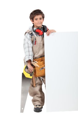 Boy builder with a board left blank for your message clipart