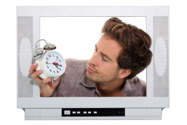 Man inside television looking at alarm clock clipart