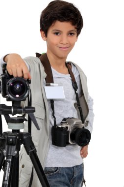 Little boy acting like a professional photographer clipart