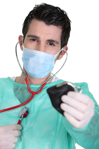 Doctor holding purse — Stock Photo, Image