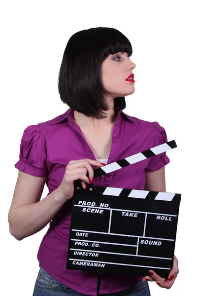 Attractive woman with a clapperboard — Stock Photo, Image