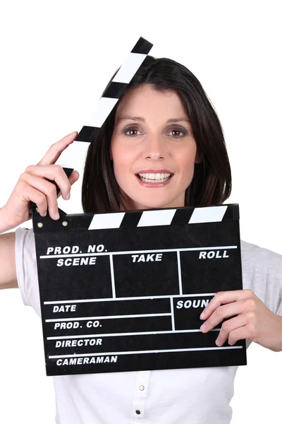 Brunette woman with movie slate — Stock Photo, Image