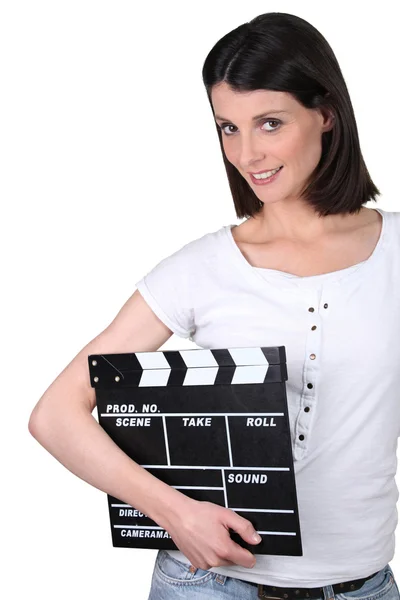 Kobieta trzyma clapperboard — Zdjęcie stockowe