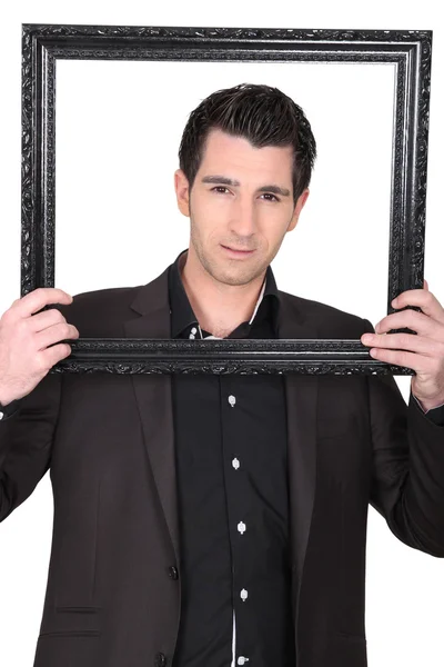 Jonge man met een zwart frame — Stockfoto