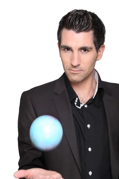 Young man holding a globe — Stock Photo, Image