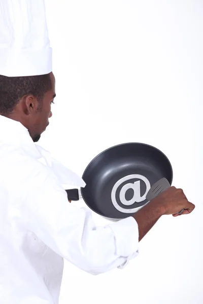 Black chef with frying pan — Stock Photo, Image