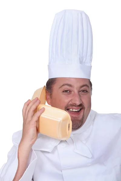 Шеф-кухар розмовляє в бургерну коробку — стокове фото