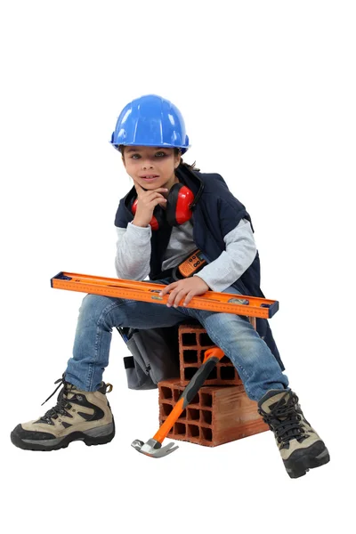 Дитина одягнена як будівельник — стокове фото