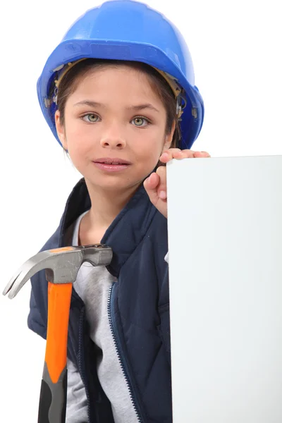 İnşaat işçisi giymiş küçük bir kız — Stok fotoğraf