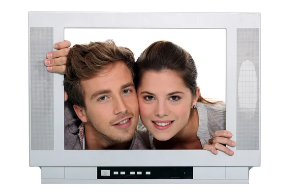 Couple posing in a television frame — Stock Photo, Image