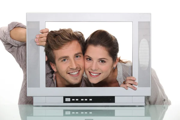 Couple inside a tv screen — Stock Photo, Image