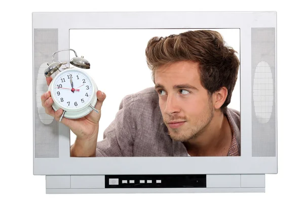 Man in televisie met alarmklok — Stockfoto