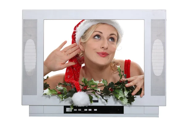 Kobieta w kapeluszu Boże Narodzenie pozowanie w ramce telewizji — Zdjęcie stockowe