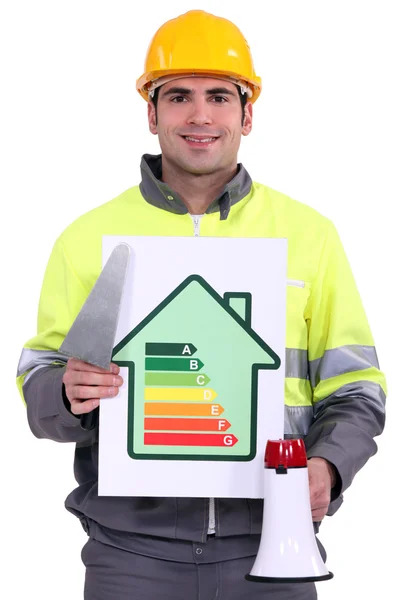 Builder with an energy efficient sign — Stock Photo, Image