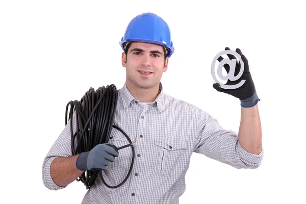 Electricista sosteniendo en el cartel — Foto de Stock