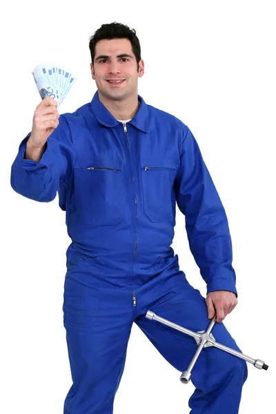Mechanic with money — Stock Photo, Image