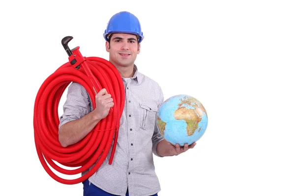 Worker with globe and wrench — Stock Photo, Image